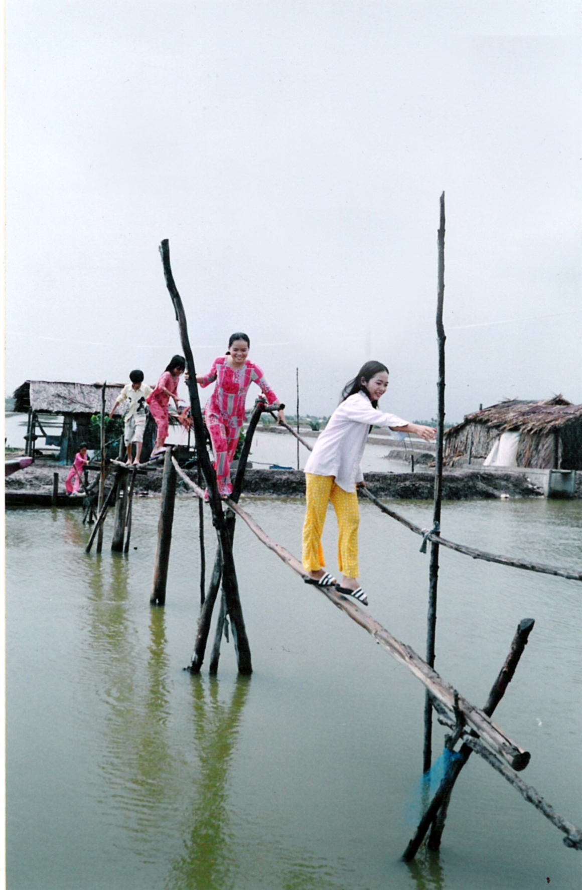 Dangerous bamboo bridge before FAVAD
